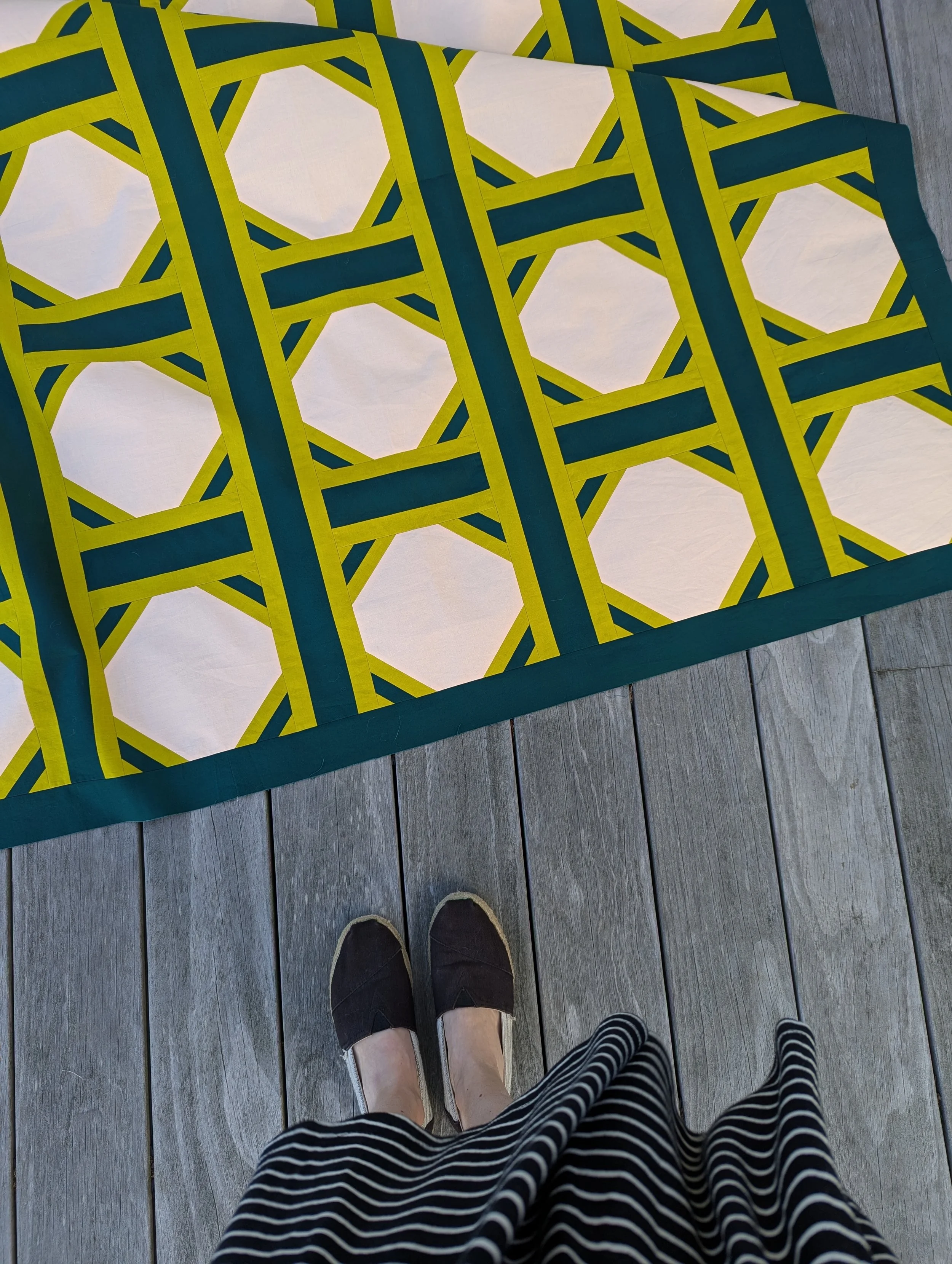 Close up of The 3017 Quilt by Millie & Bun Designs in green and pink colors