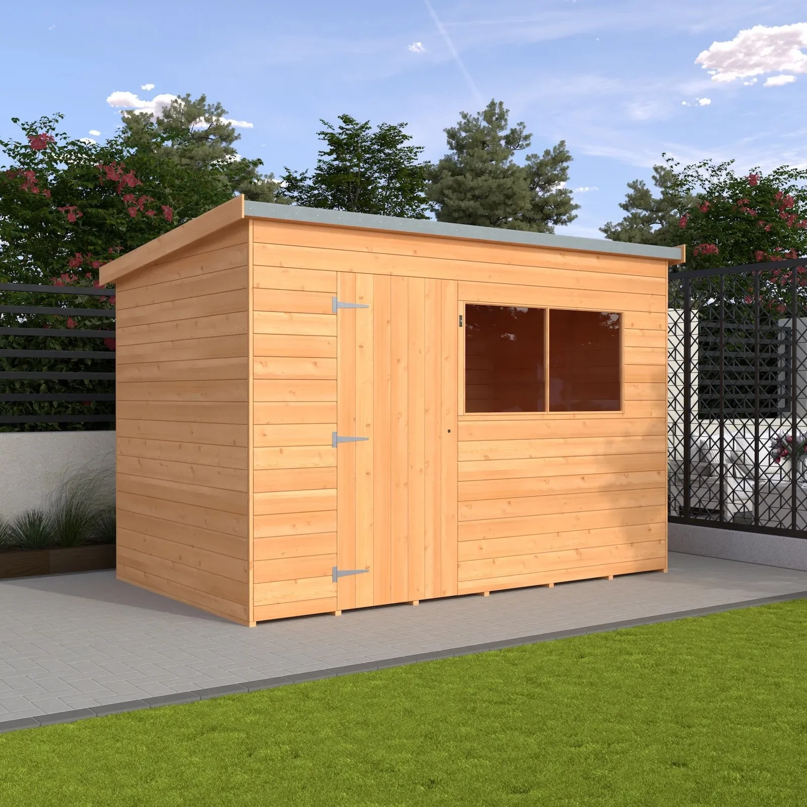 Wooden garden shed with a slanted roof on a patio, surrounded by greenery and fenced area.