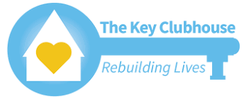 Logo of The Key Clubhouse featuring a blue key shape with a white house icon and a yellow heart, accompanied by the text 'The Key Clubhouse' and 'Rebuilding Lives.'