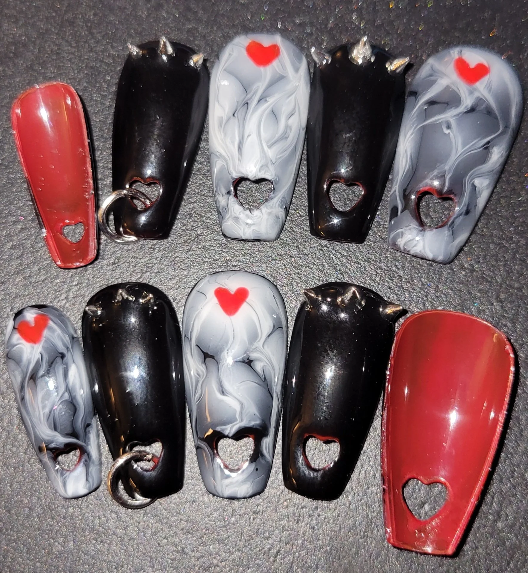 heart spike red bottom nails.jpg