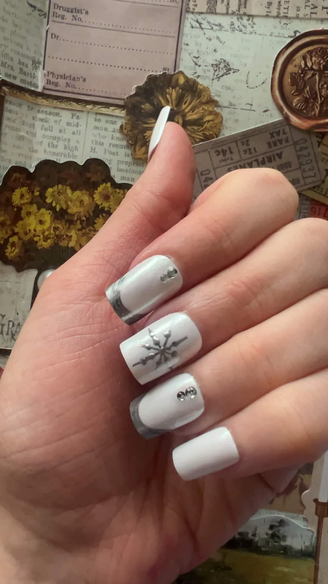 Chloe's white snowflake nails.jpg
