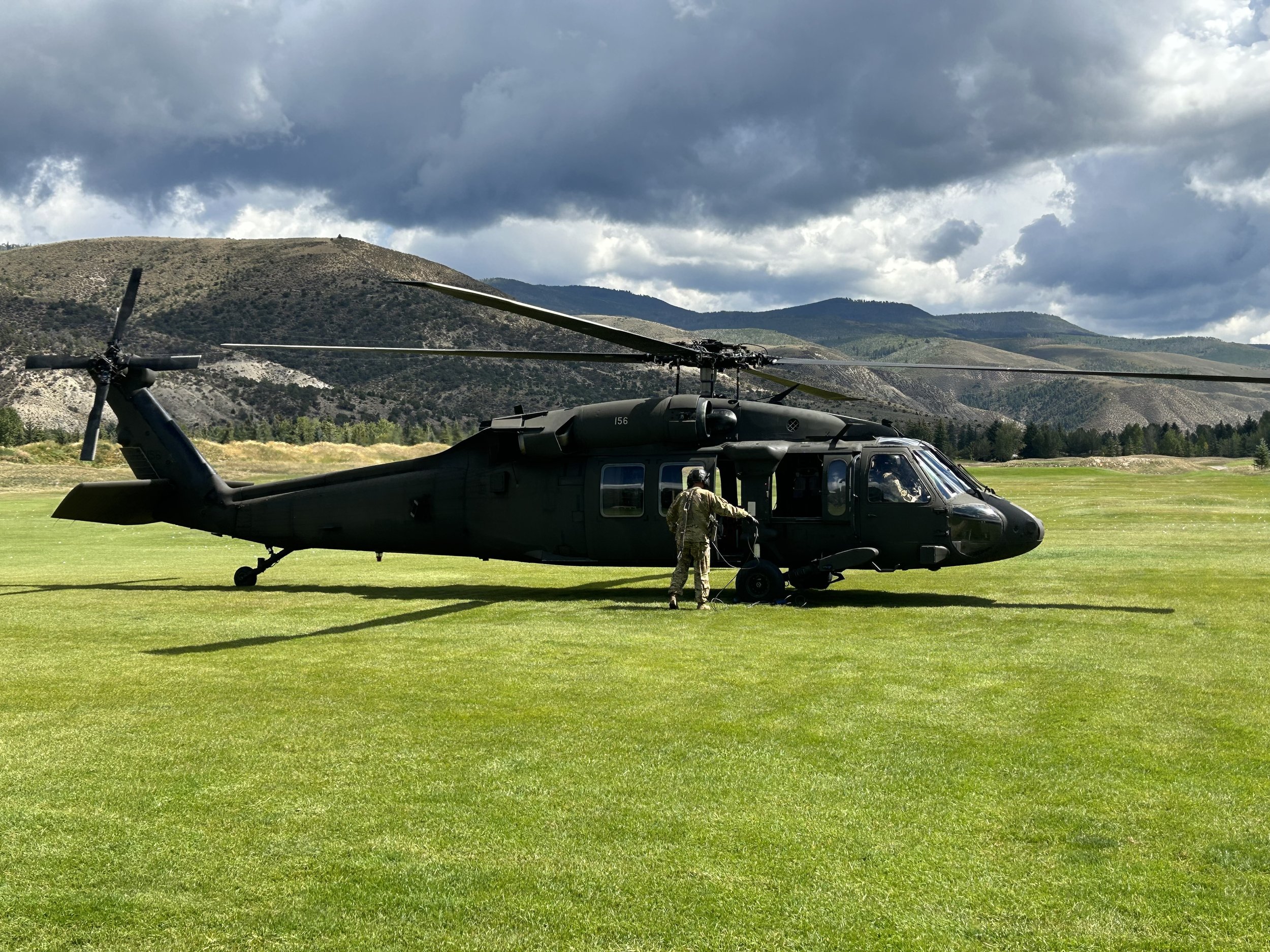 Black Hawk helicopter landing on golf range