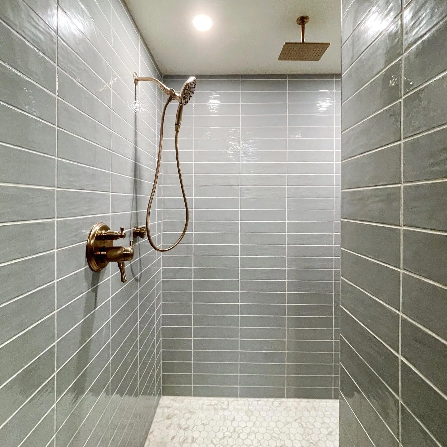 Custom walk-in shower featuring soft, blue tile for a relaxing, spa-like feel 🌱 
&bull;

&bull;

&bull;

#interiordesign #interiordesigner #fargodesign #fargointeriordesign #northdakotainteriordesign #grandforksinteriordesign #grandforks #northdakot