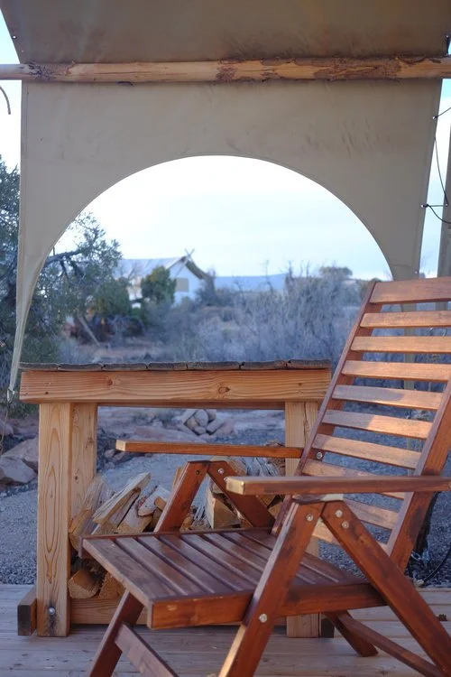 Chair on the front deck of a glamping tent at Under Canvas in Moab, Utah