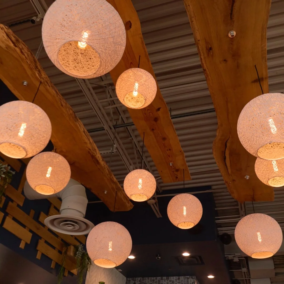 Warm ambient lighting with modern globe fixtures at Liberty Tavern Polaris, creating an inviting atmosphere for private dining and special events in Columbus.