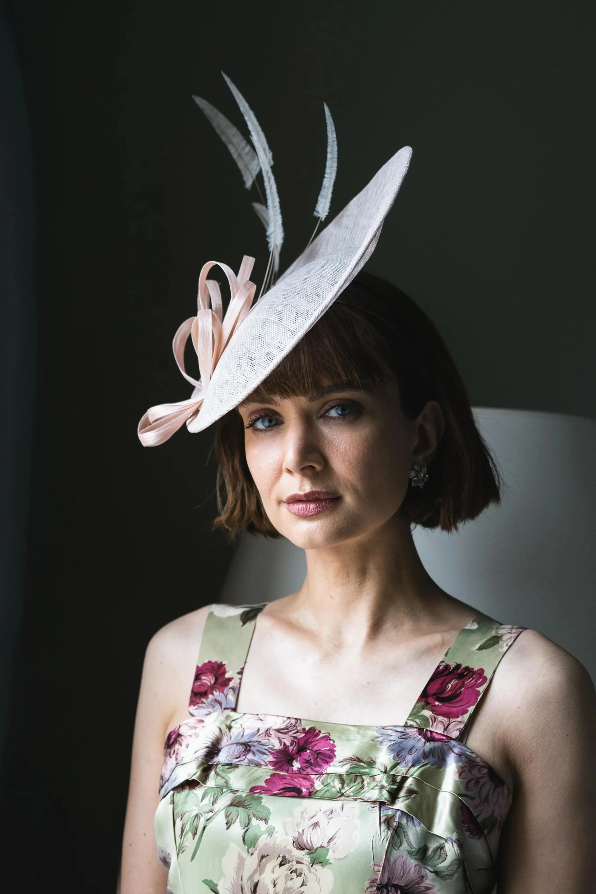 unfussy hat on hairband wit arrow feather