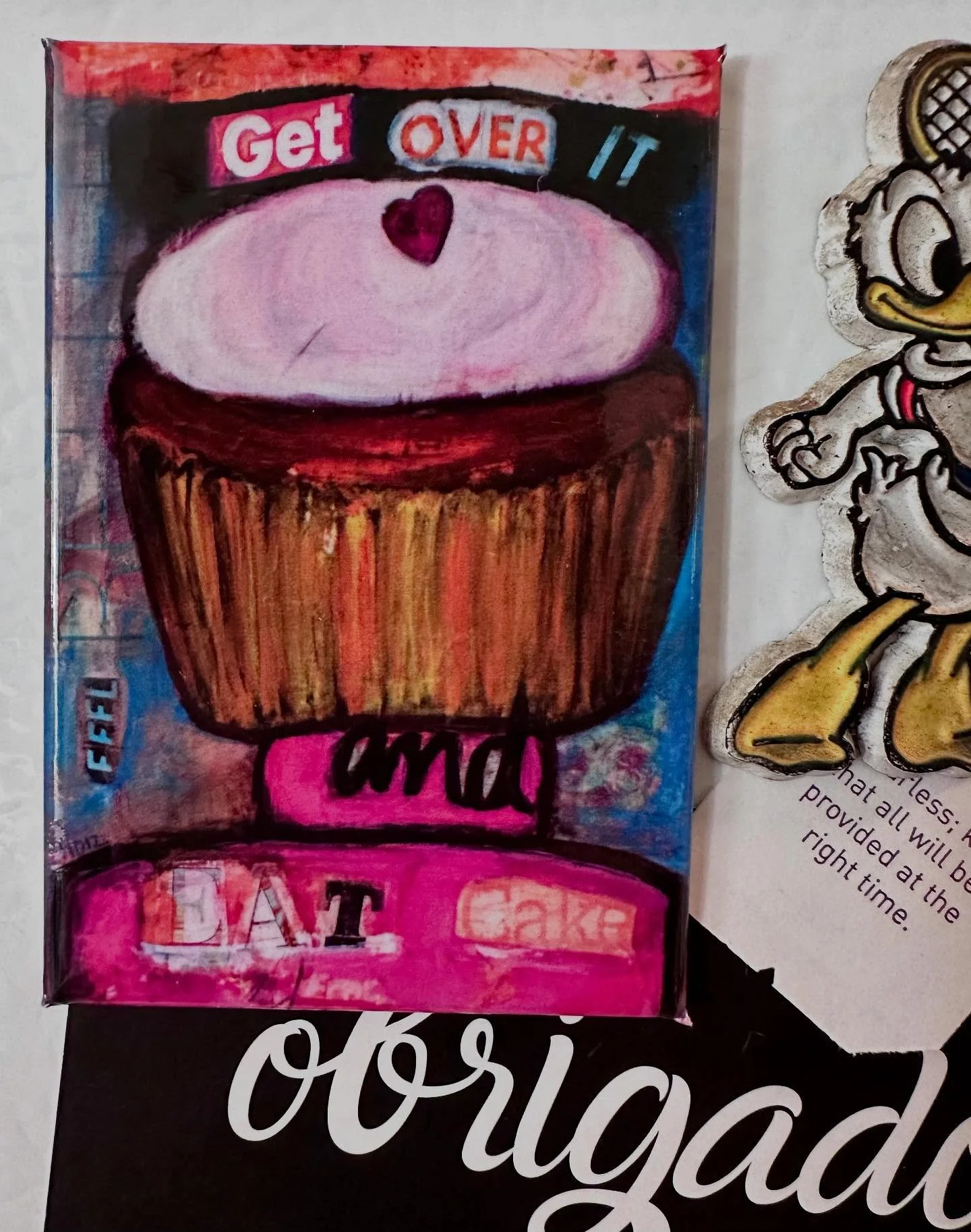 My sister and I had a saying if something was bothering us, &ldquo;Get over and eat cake.&rdquo; That saying became a collage piece years ago. That piece sold, and I still have prints of it, but I thought why not take it a step further and make it a 
