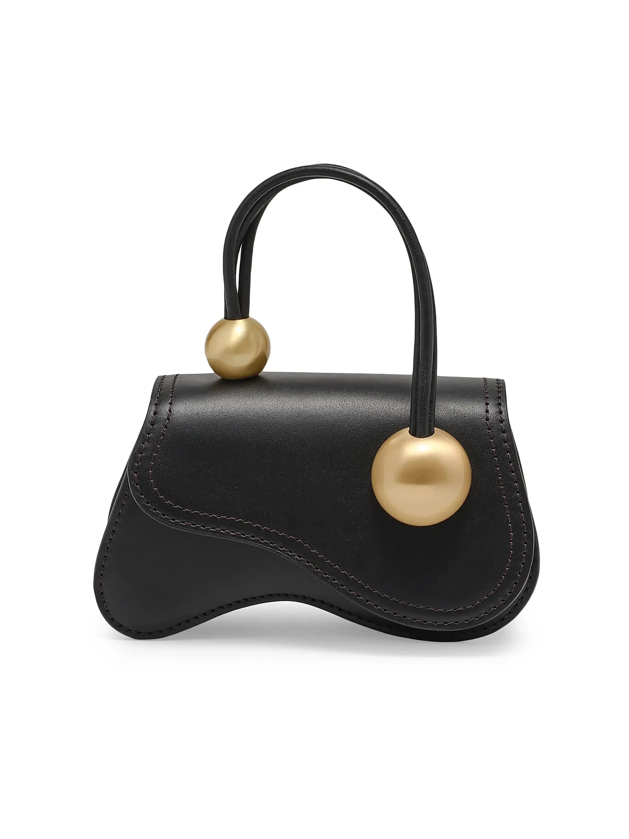 A black leather handbag with large gold spherical accents on the handle.