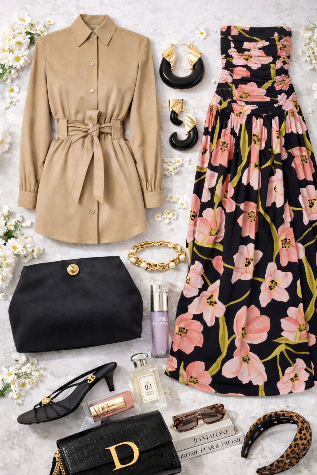 Flat lay of women's fashion and accessories including a beige belted trench coat, floral skirt, black clutch, black high heel sandals, leopard print headband, sunglasses, gold and pearl jewelry, perfume bottles, and flowers on a light background.