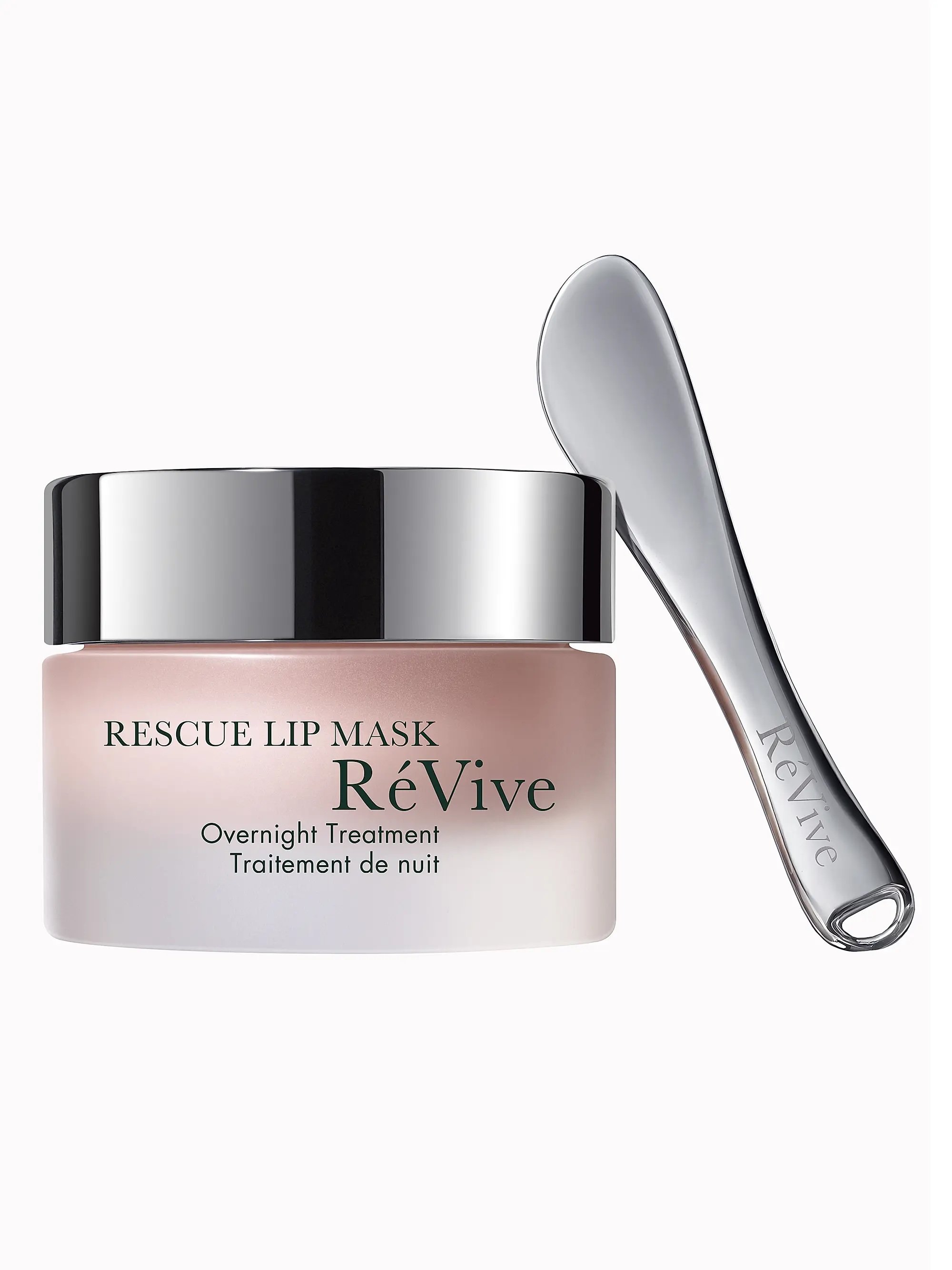 A jar of ReVive Rescue Lip Mask with a silver lid, accompanied by a silver spatula with 'ReVive' engraved on it, set against a plain white background.