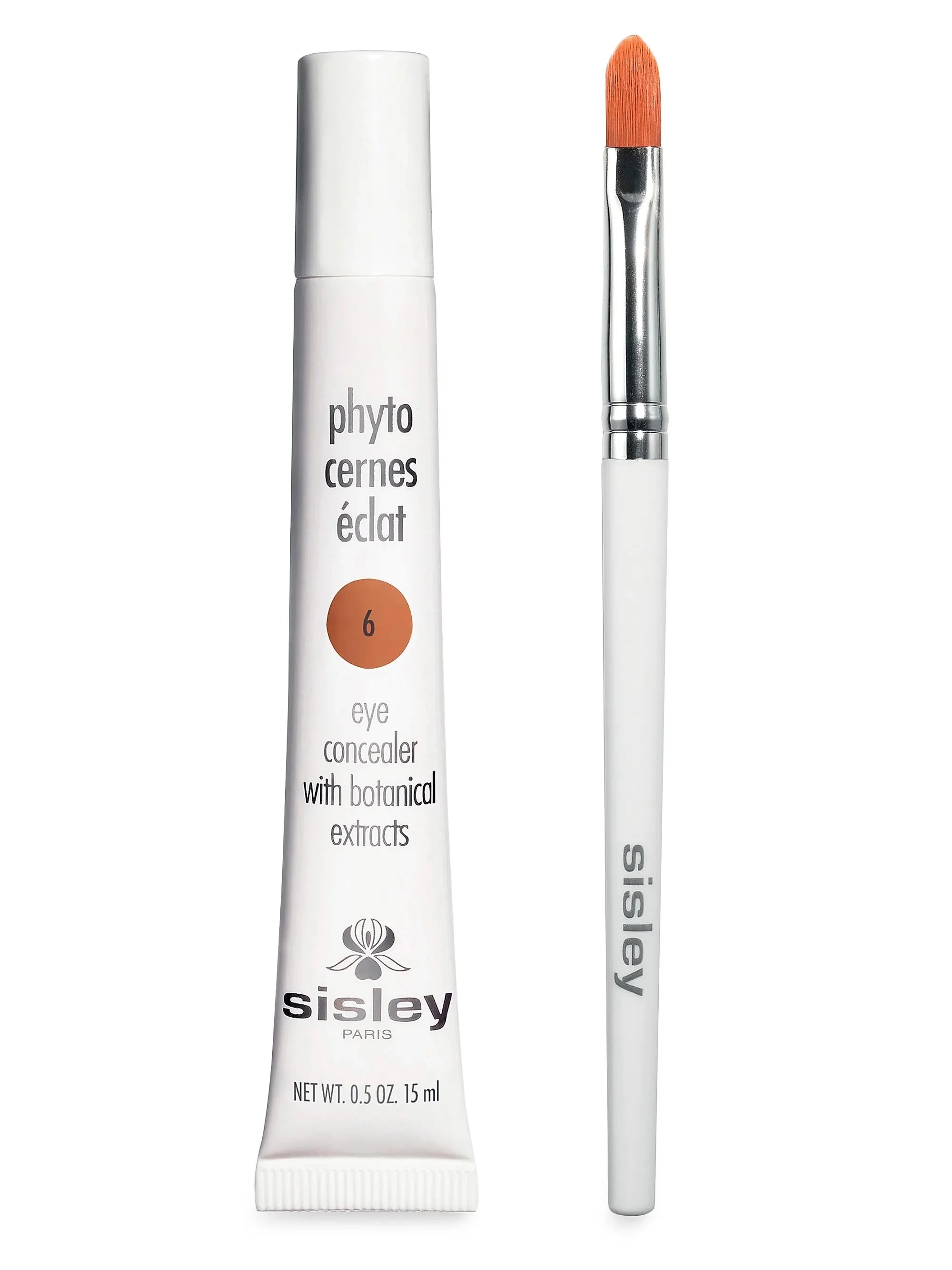 Tube of Sisley eye concealer with botanical extracts and a small makeup brush.