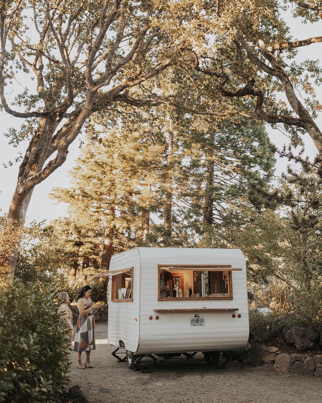 We always love when photographers capture new perspectives of the property feat. vendors we love 📸specifically dig this shot of the @tiddlytrailer parked in the driveway at golden hour surrounded by oaks and laurels and that cocktail hour magic 🥂✨