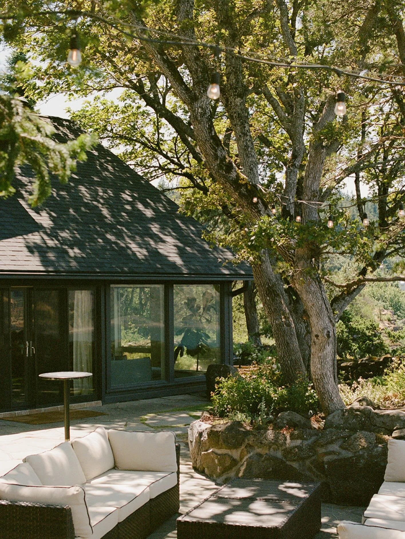 A peek from the Eastern Lawn to the Welcome Terrace. The property is full of little nooks and spots intended for personalization &mdash; cocktails here, music there, a photobooth, or set of llamas for guests to nuzzle 🦙 Somehow you can make almost a
