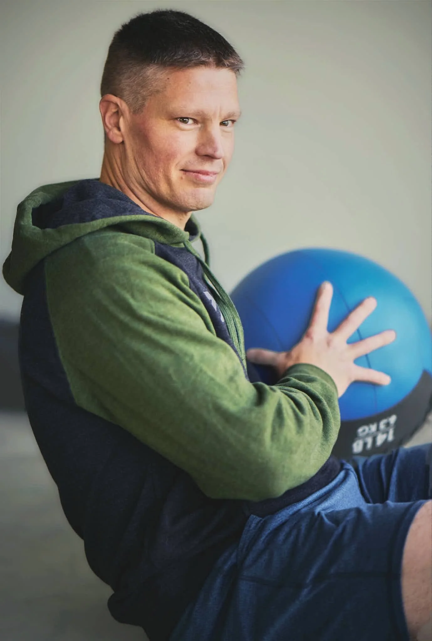 Man-training-in-garage-with-medicine-ball 1.jpg