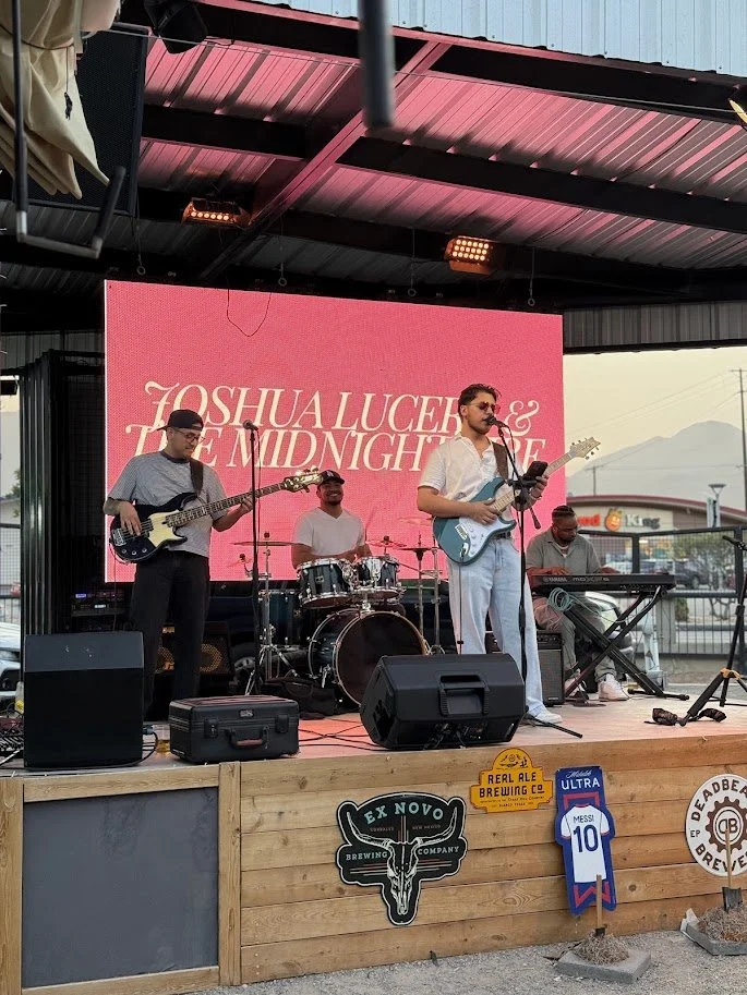 Live music performance on the outdoor patio stage at NEEP Collective in El Paso
