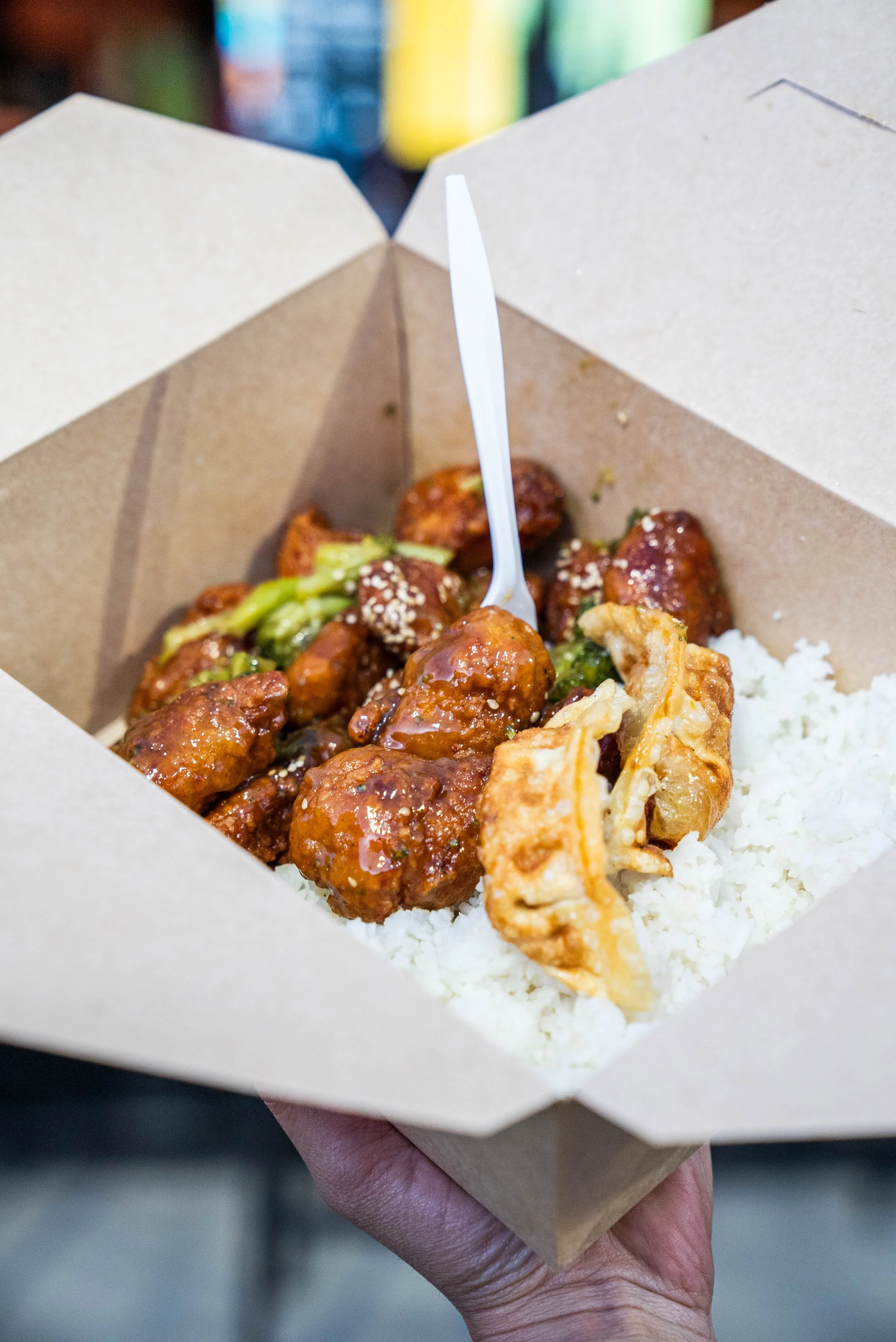 Mi Asia rice bowl with orange chicken, rice, and crispy wontons at NEEP Collective
