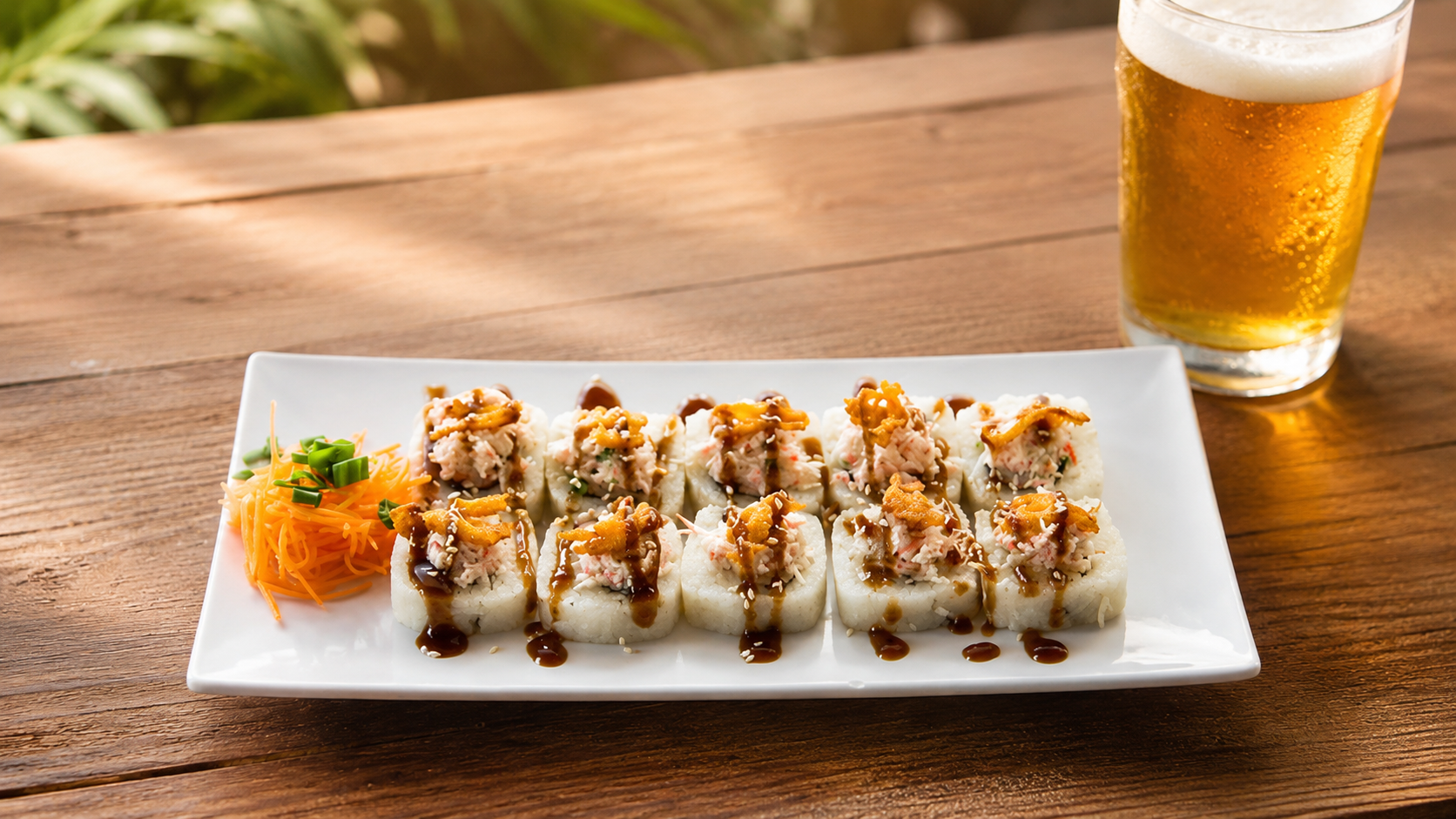 Sushi rolls with a cold beer on a wooden table at NEEP Collective food truck park in Northeast El Paso