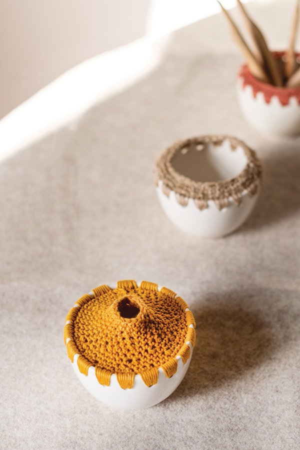 Handmade ceramic small pots with crochet detail by Rita Kroh in mustard and neutral tones