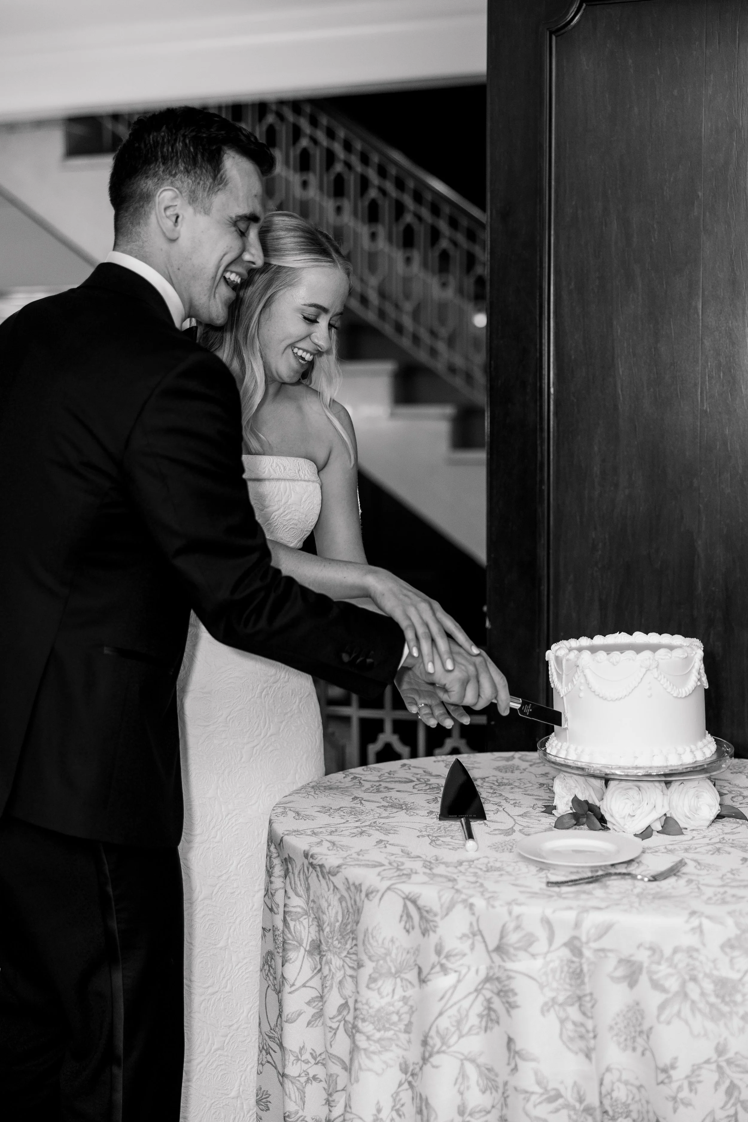 bride and groom cutting their wedding cake at hotel northland