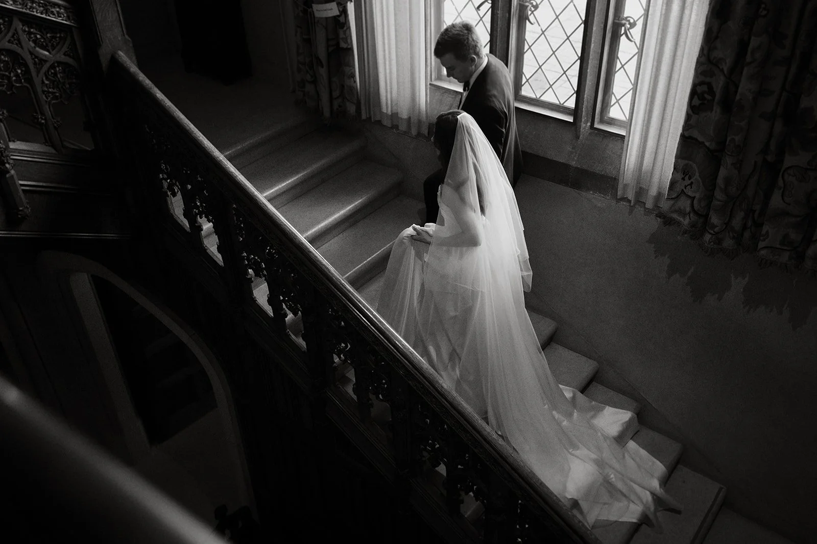 Paine Art Center Wedding Couple on Grand Staircase.