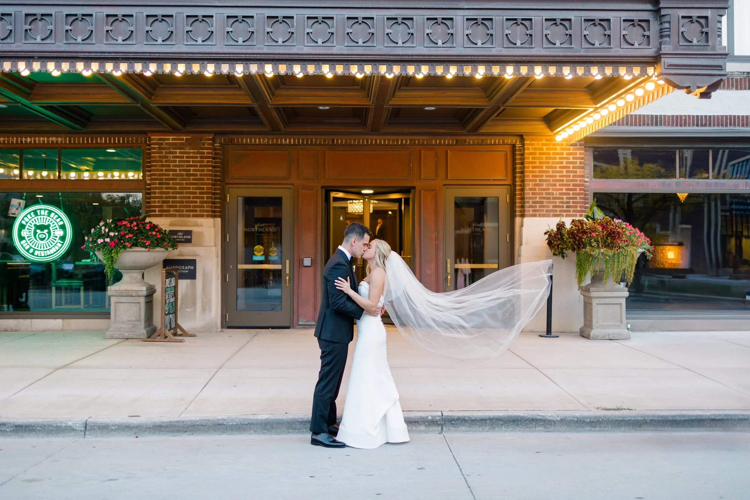 bride and groom outside of hotel northland wedding venue