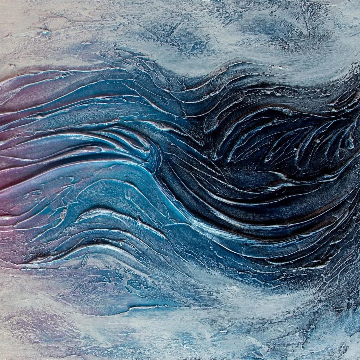 Close-up of a textured, abstract painting with swirling brushstrokes in shades of blue, black, and gray.