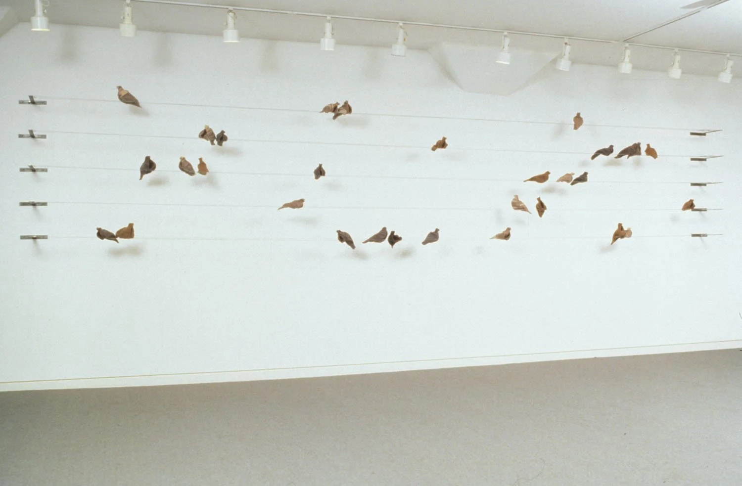 "Exodus", 1997, Blankets, wire, zippers, thread, cable, 52 x 324 x 17 inches