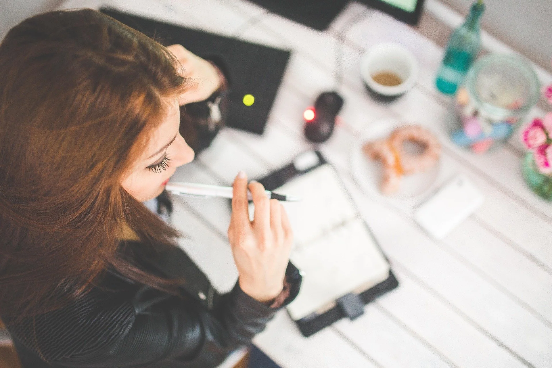 Woman reviewing legal documents at a desk