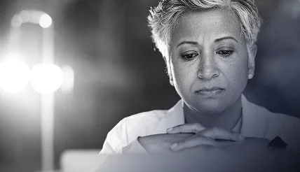 Woman looking deep in thought.