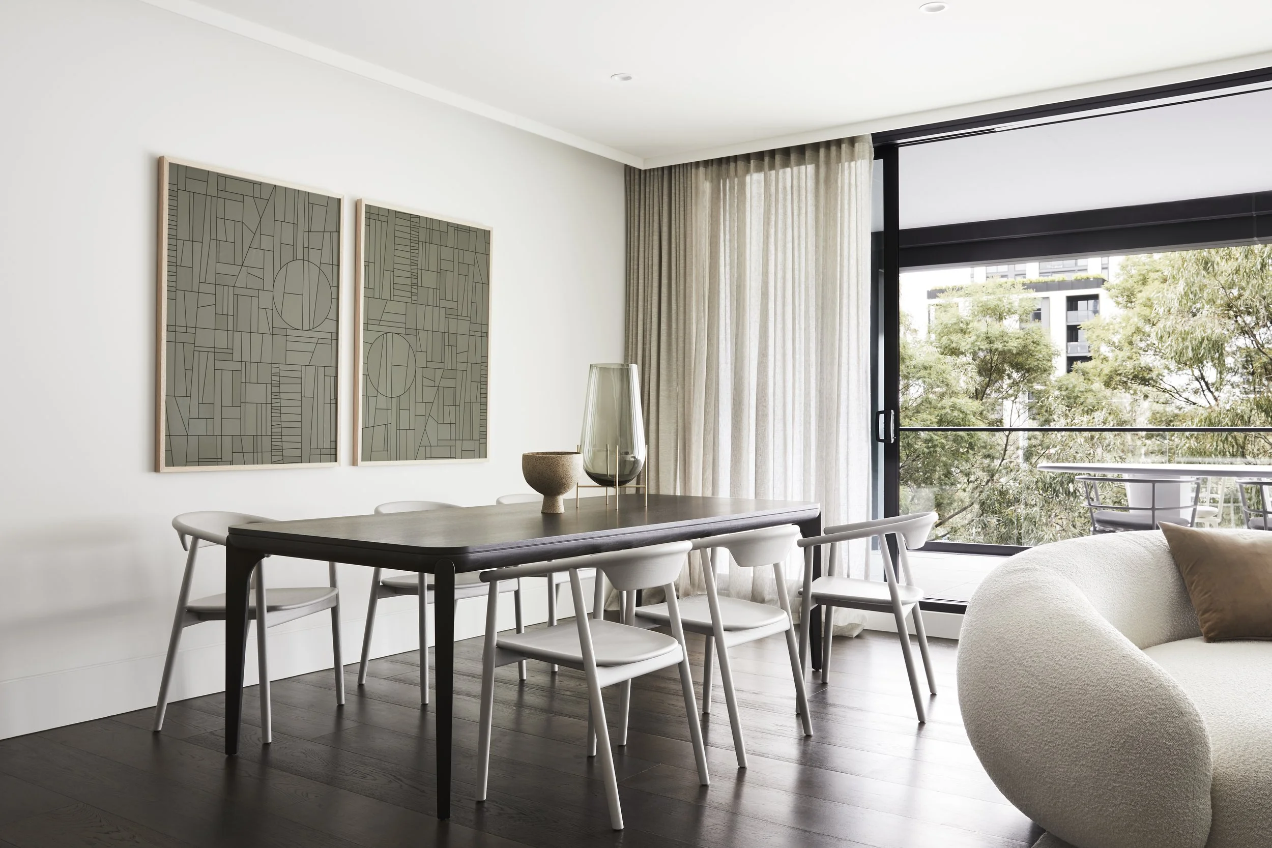 Dining room with sheer curtains and balcony outlook, interiors photography