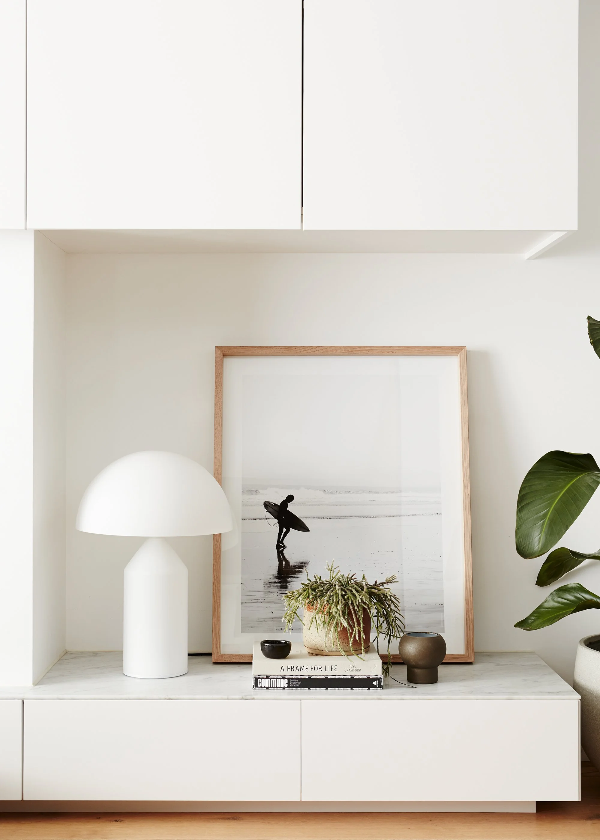 Lounge room detail with surf photo and white lamp