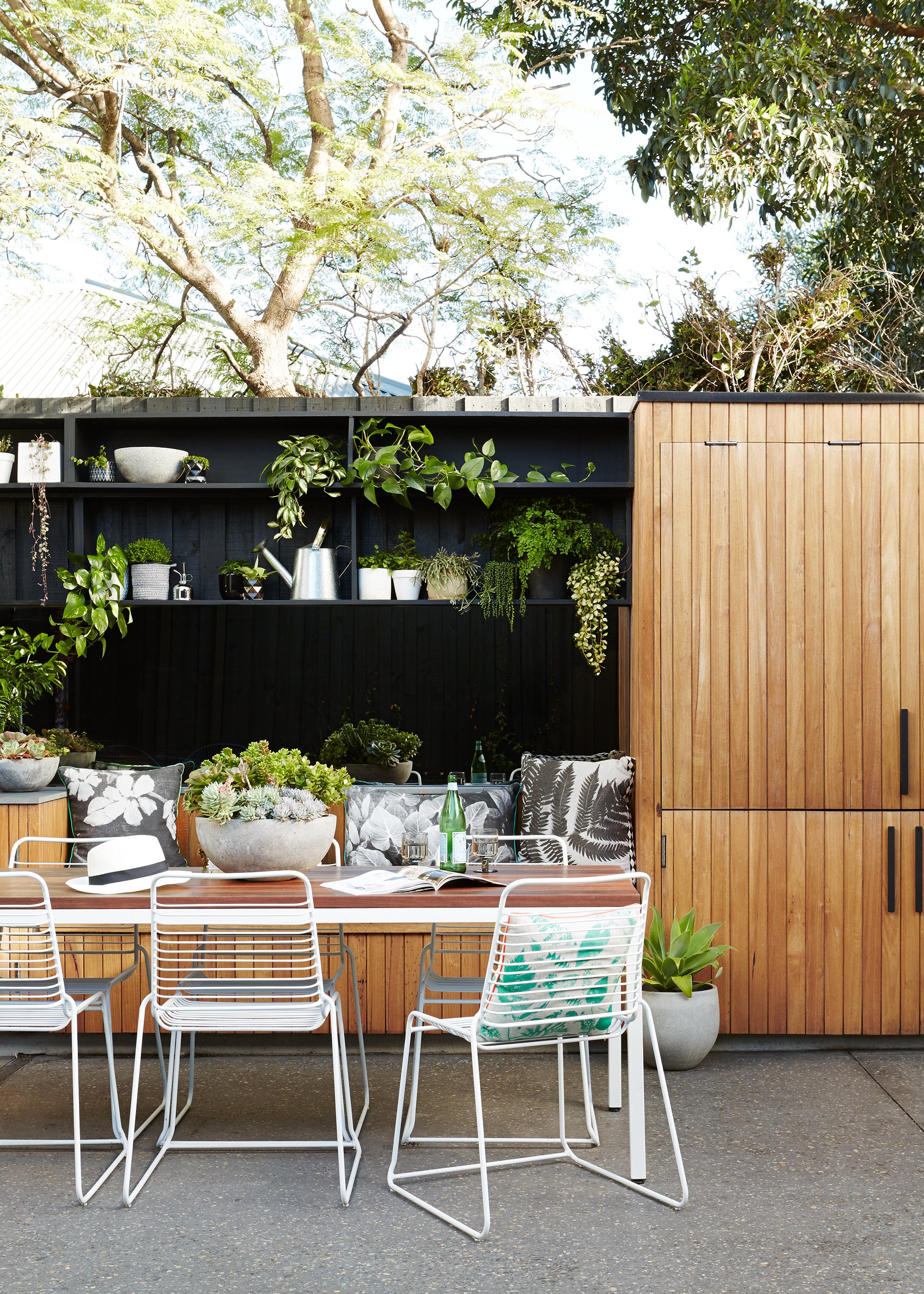 Outdoor table setting with timber cabinet