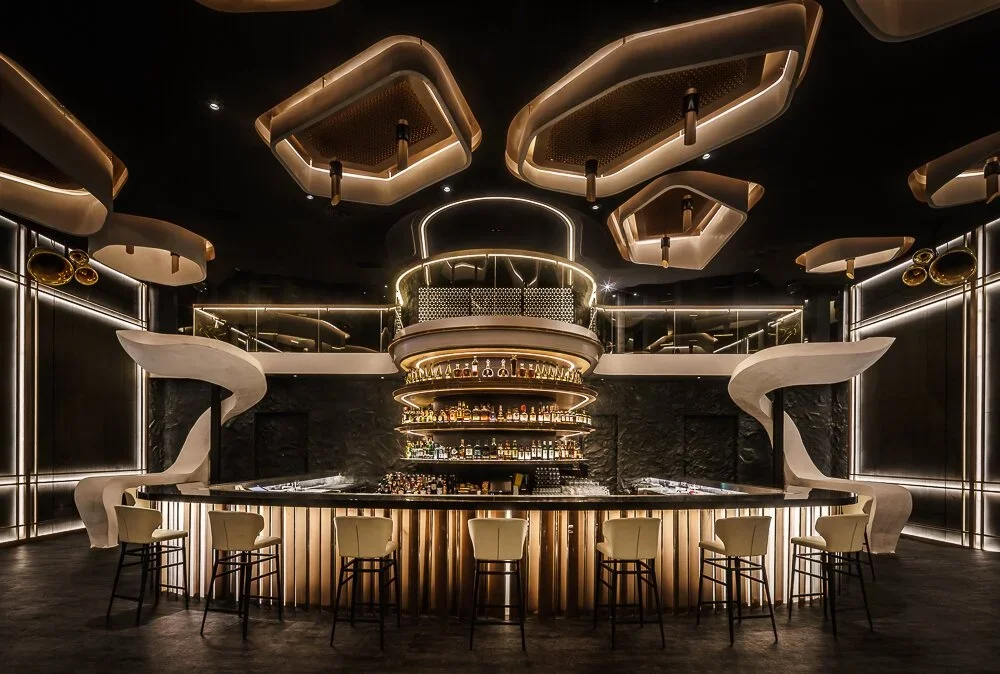 KOR Taipei – central bar framed by curved staircases and ceiling features – hospitality interior – Taipei, Taiwan
