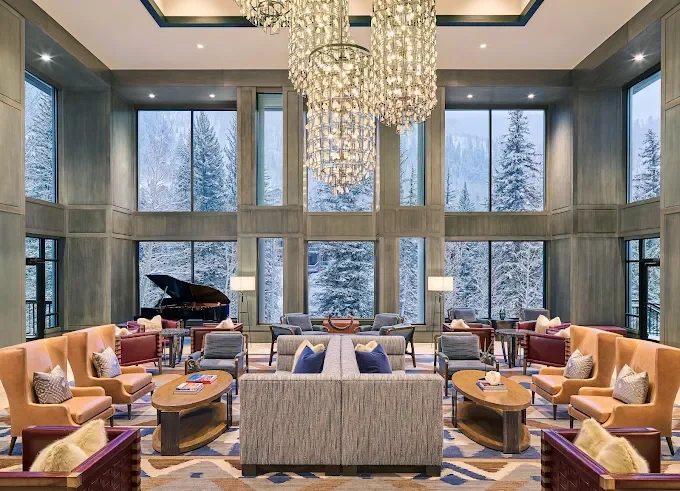 Grand Hyatt Vail – lobby lounge with crystal chandelier and snowy mountain views – hotel interior – Vail, CO