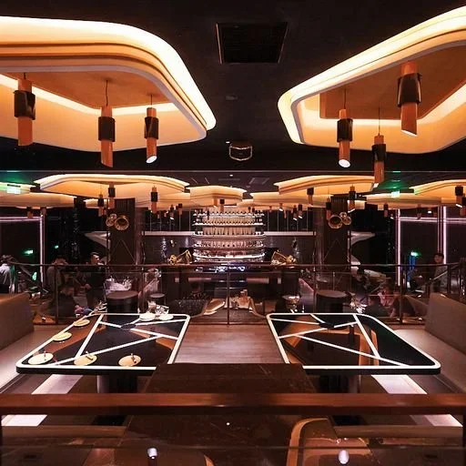 KOR Shanghai – dining lounge with geometric tables and central DJ booth – hospitality interior – Shanghai, China