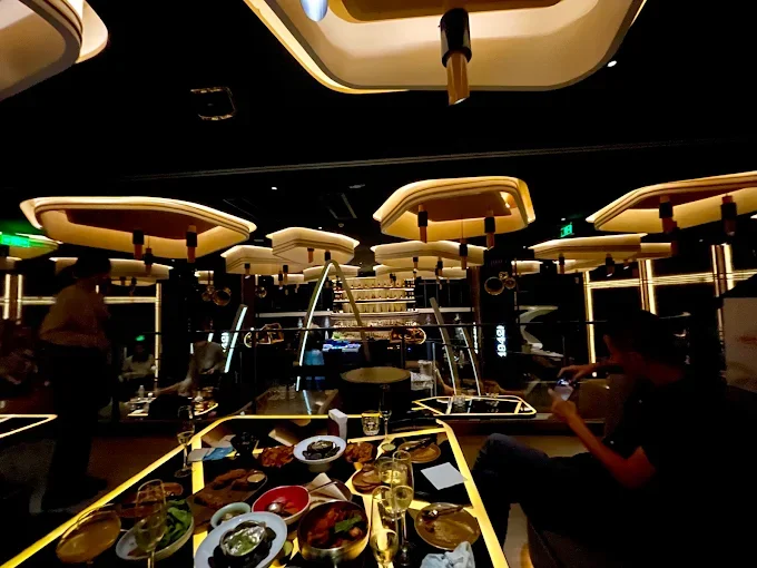KOR Shanghai – dining area with illuminated ceiling features and DJ booth – hospitality interior – Shanghai, China