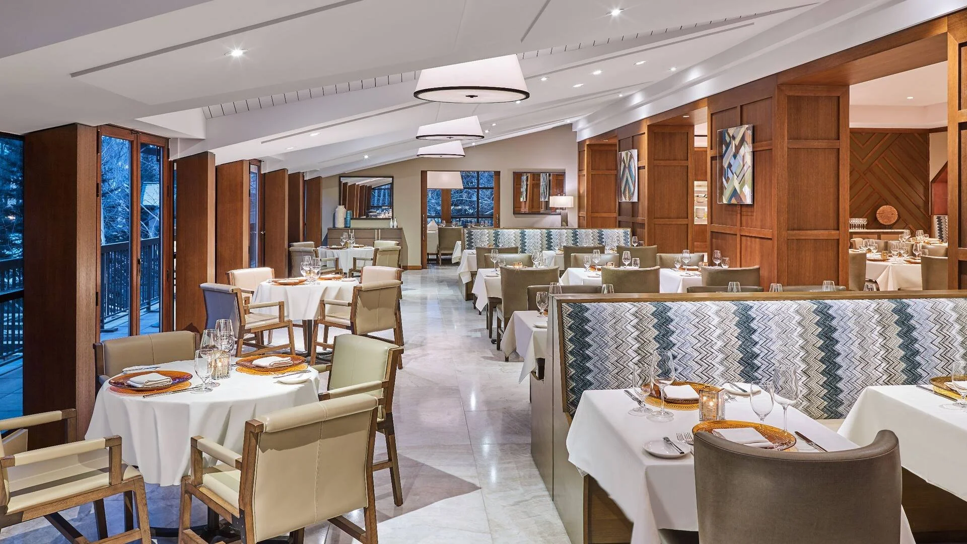 Grand Hyatt Vail – restaurant dining room with booth seating and wood-paneled walls – interior design – Vail, CO