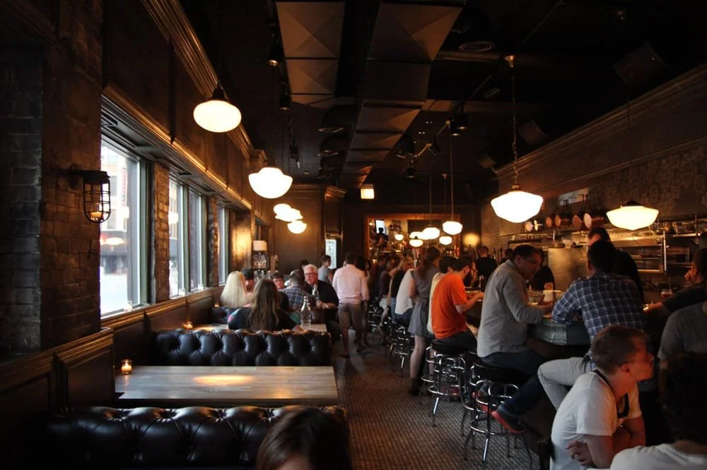 Au Cheval restaurant dining room in Chicago's West Loop with sound system by Pineapple Audio