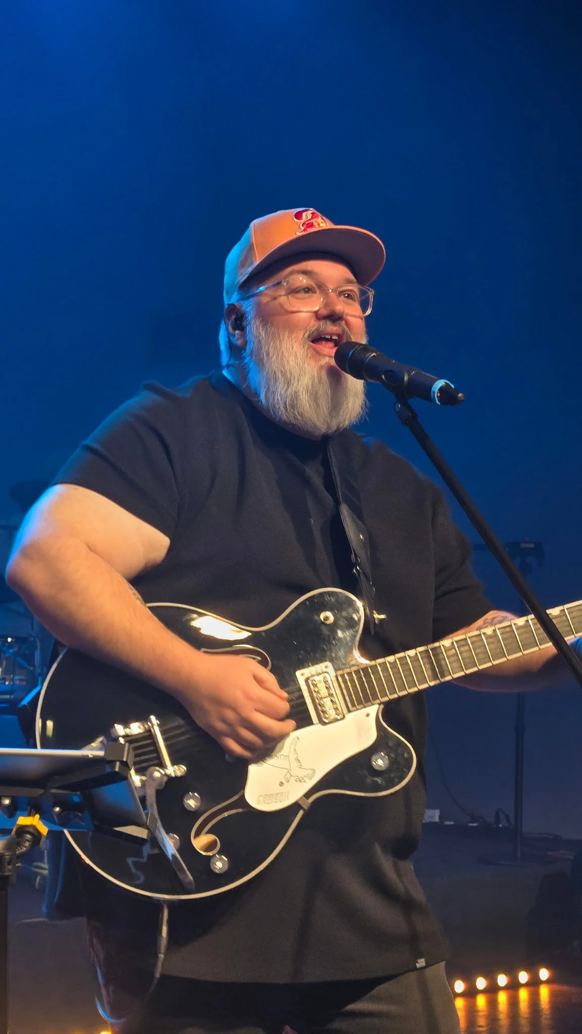 Pastor Ron Gehrke II leading worship from the guitar during a Sunday morning service.