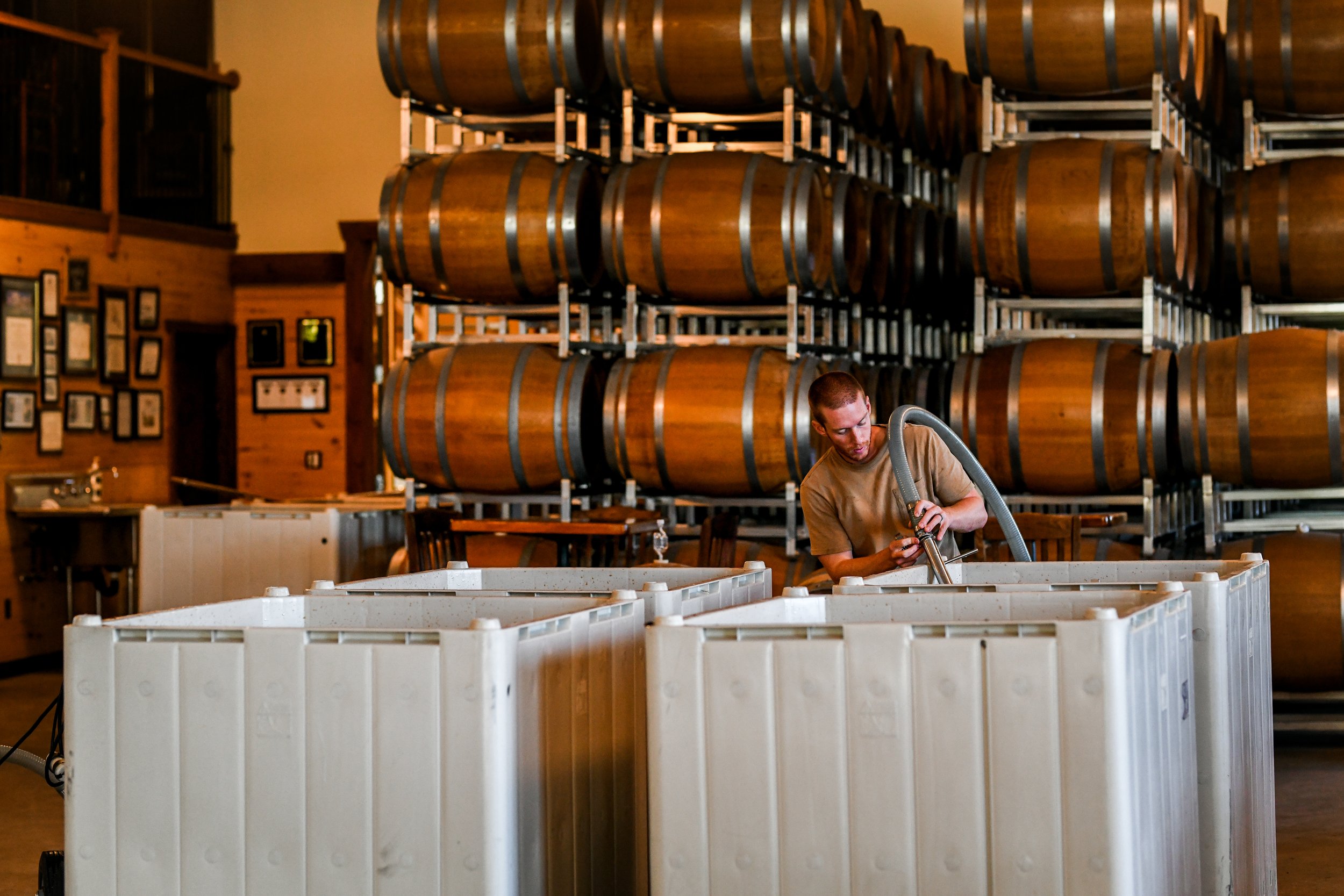 Mike siphoning from wine from fermentation