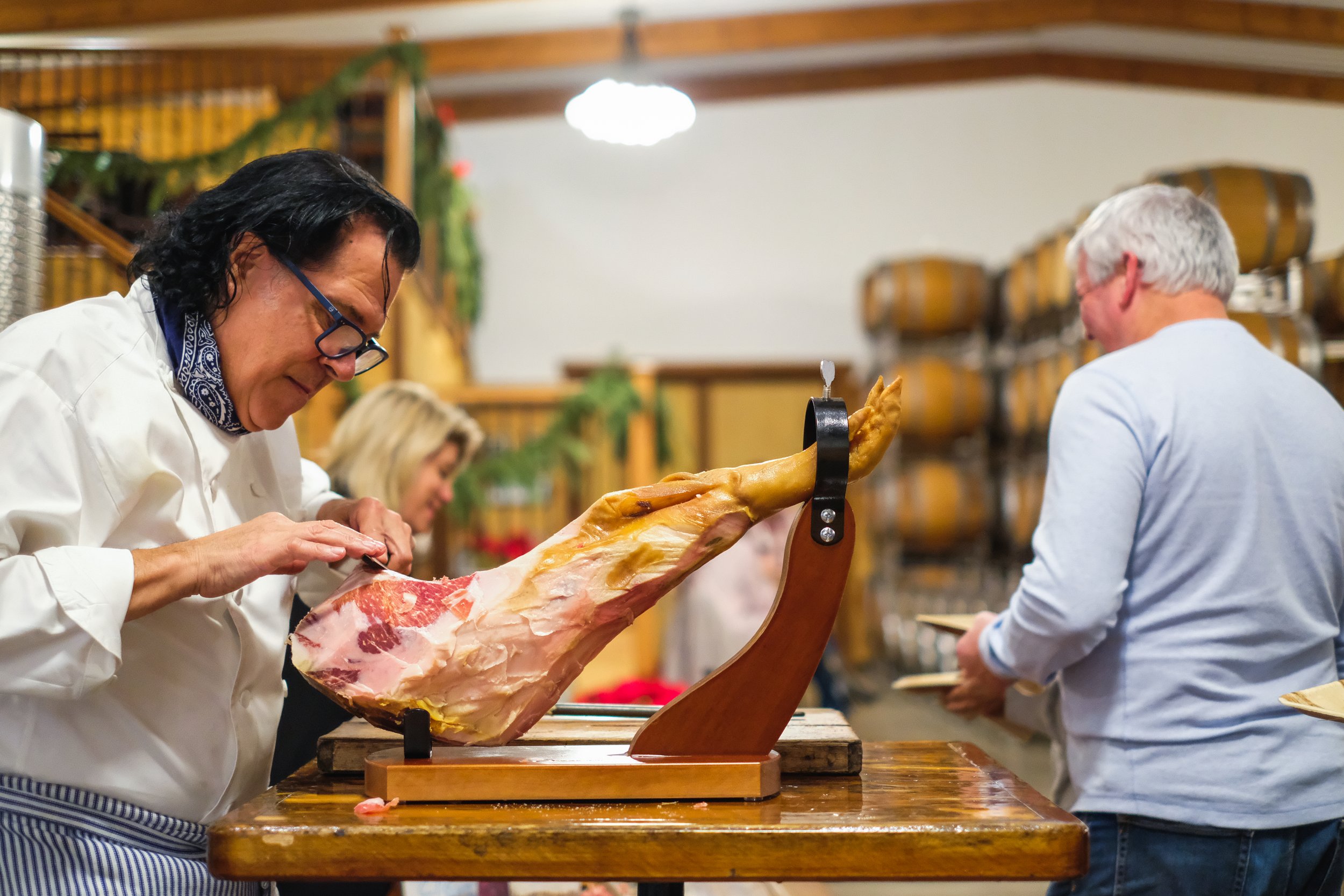 Prosciutto being carved at a Moonlighters event