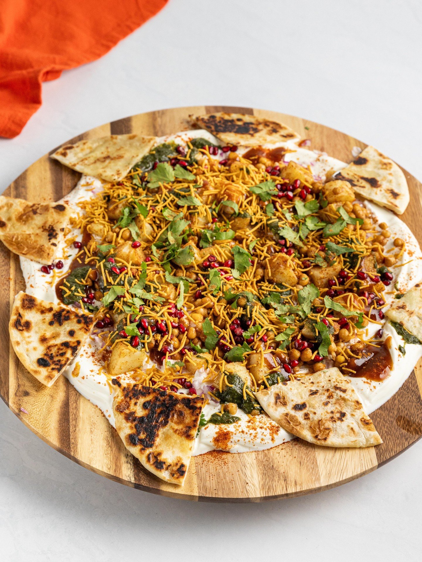 Snack boards just got a serious upgrade!😍 This Chaat Board featuring authentic Indian snacks is the ultimate party platter. Loaded with creamy yoghurt, @haldiramsaustralia crispy sweet potato noodles, cheese naan, and all the crunchy, spicy, tangy g