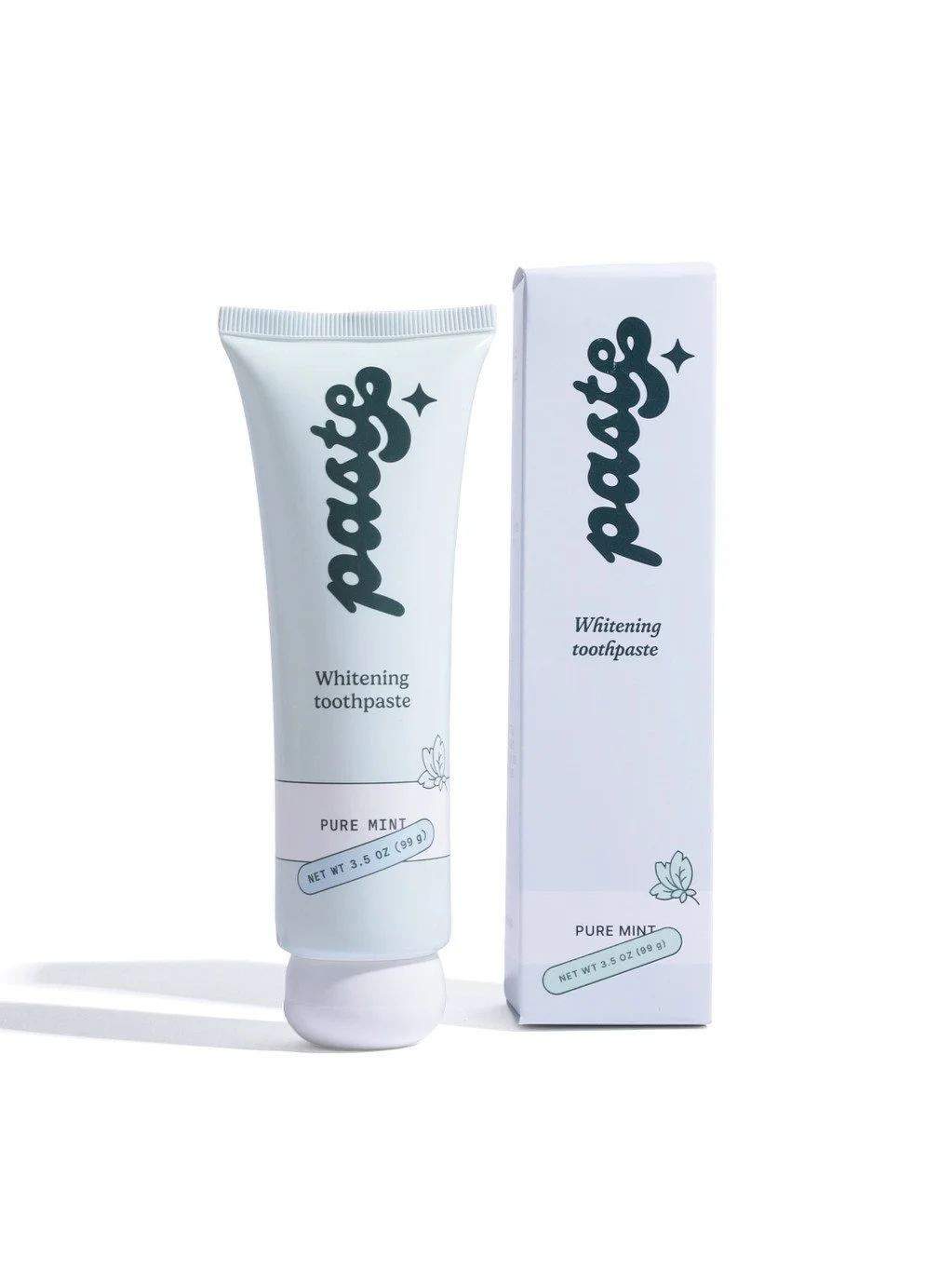 A tube of mint whitening toothpaste upright on the left with its box counterpart on the right.