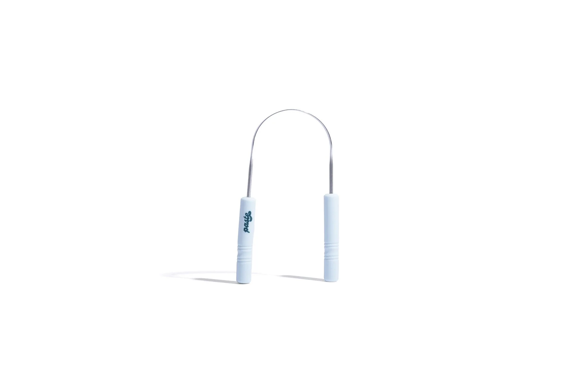 The tongue scraper standing upright.