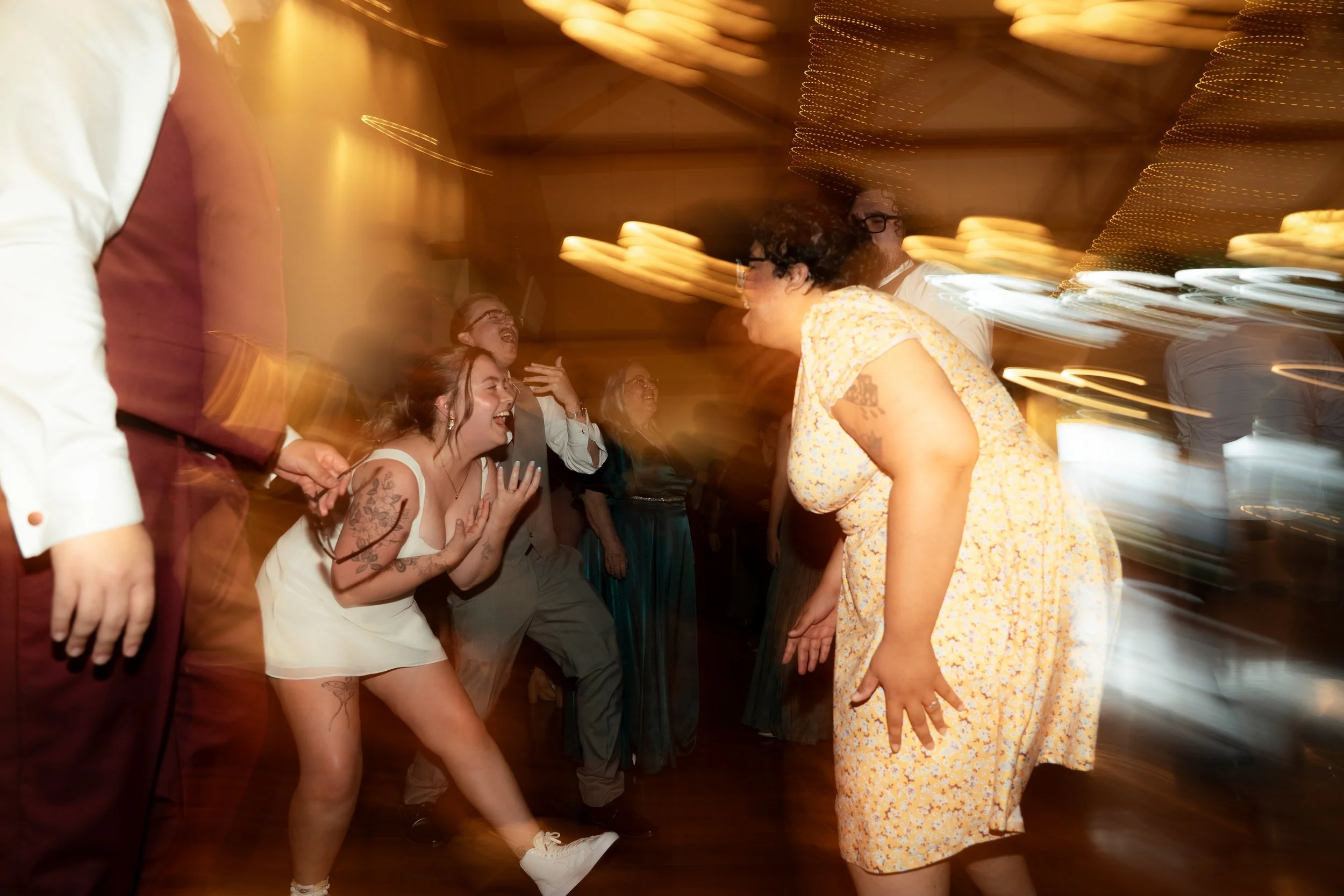 Fun light flare dance photographer wedding