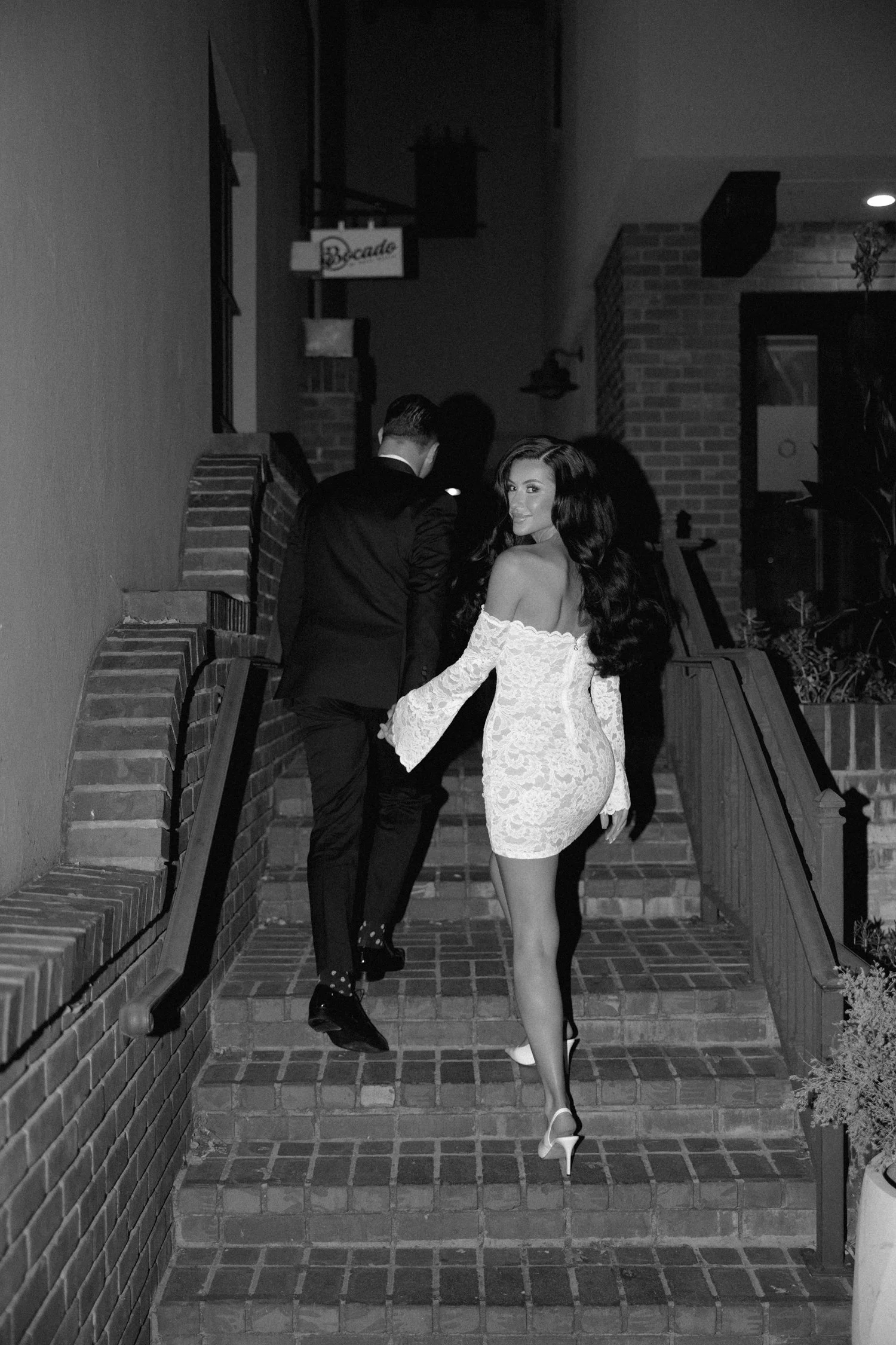 black and white editorial elevated bar restauraunt engagement session.jpg