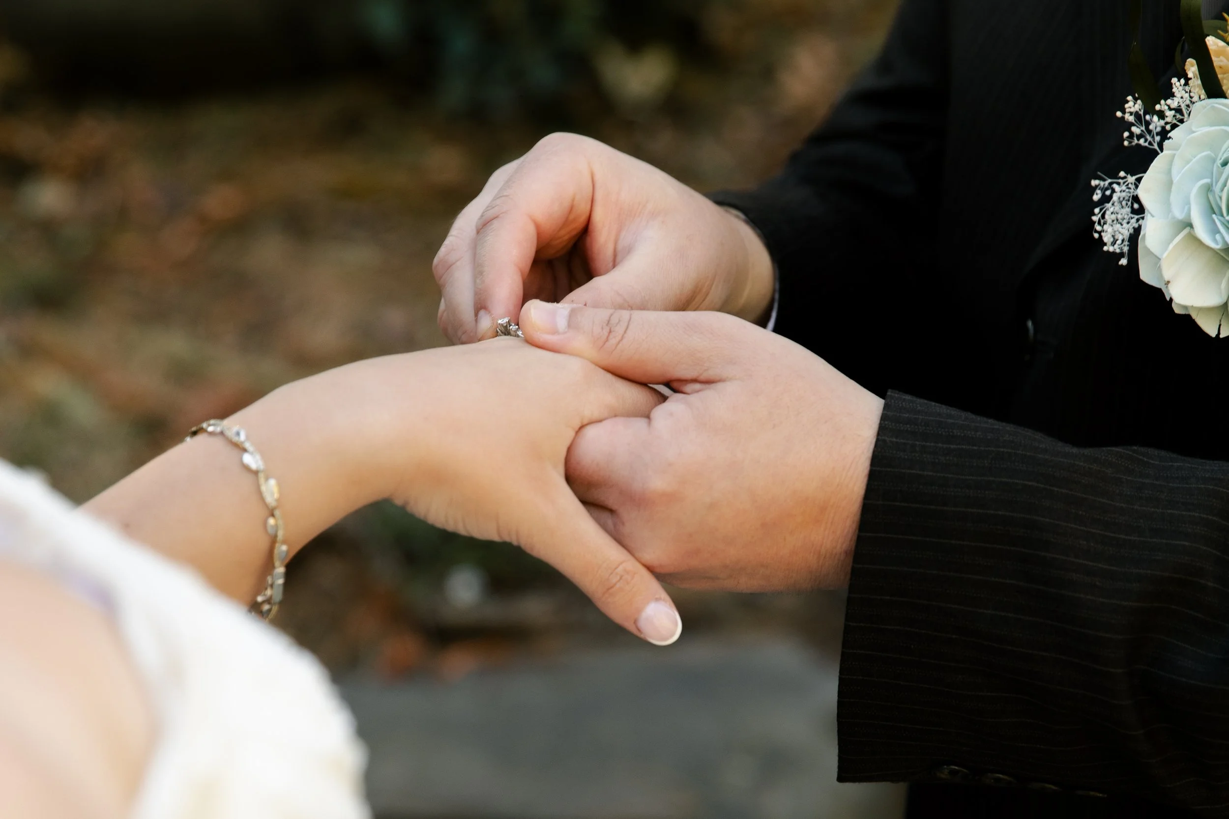 ring ceremony during a wedding exchanging of rings california engagement photographer.jpg