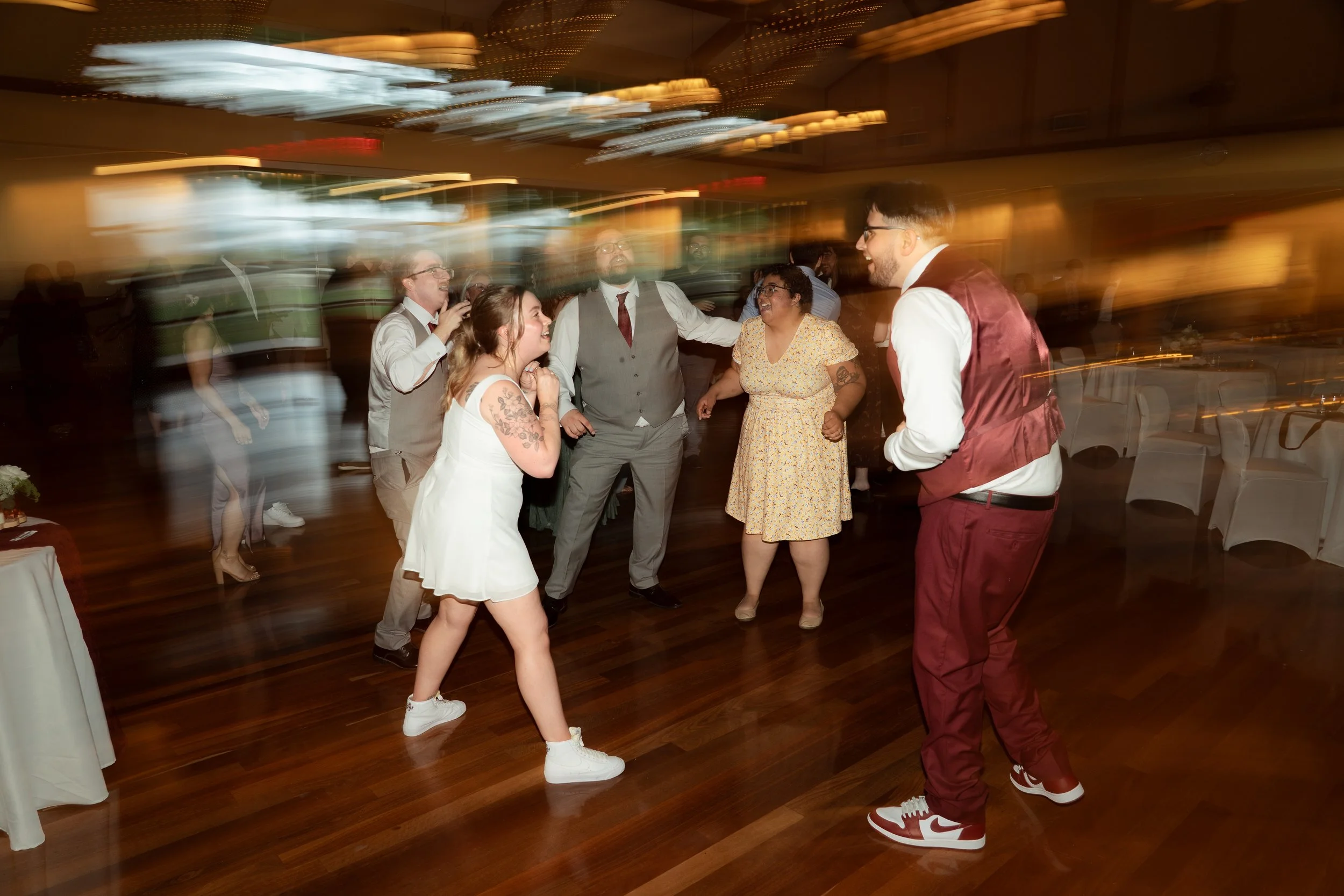 Fun light flare dance photographer wedding