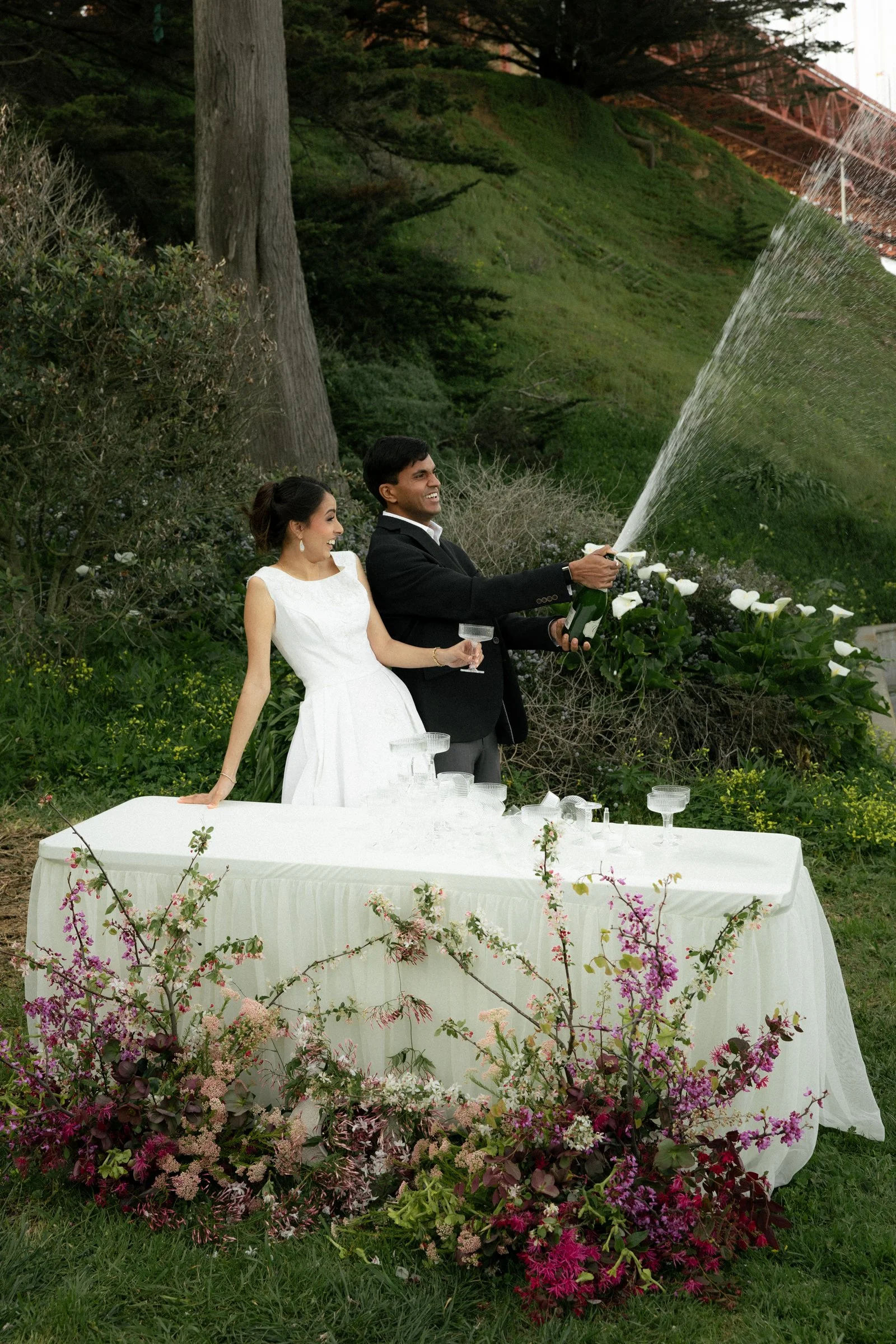 popping champagne photos on an elopement day