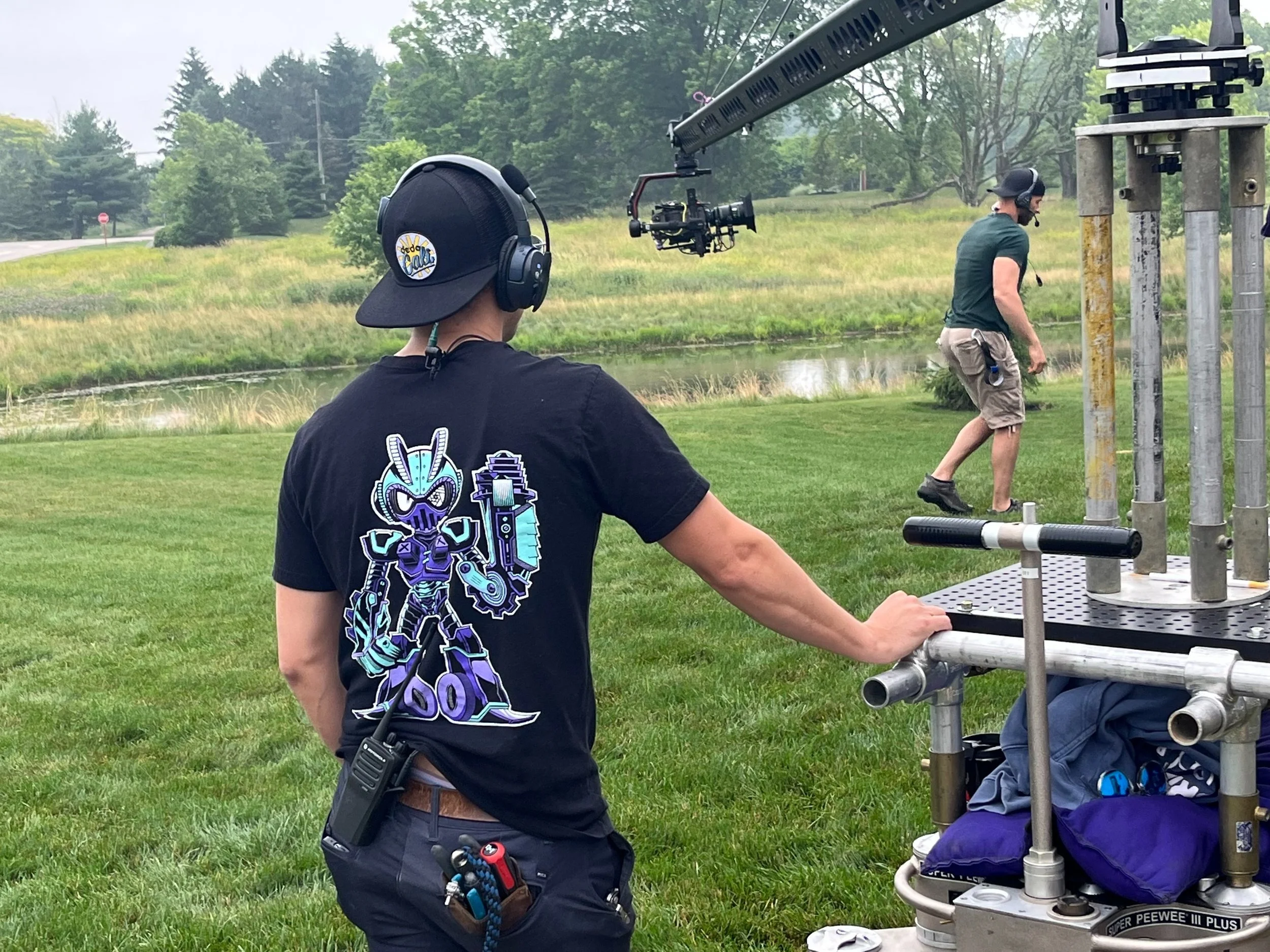 Ohio CineMotion crew working a camera crane on an outdoor film set
